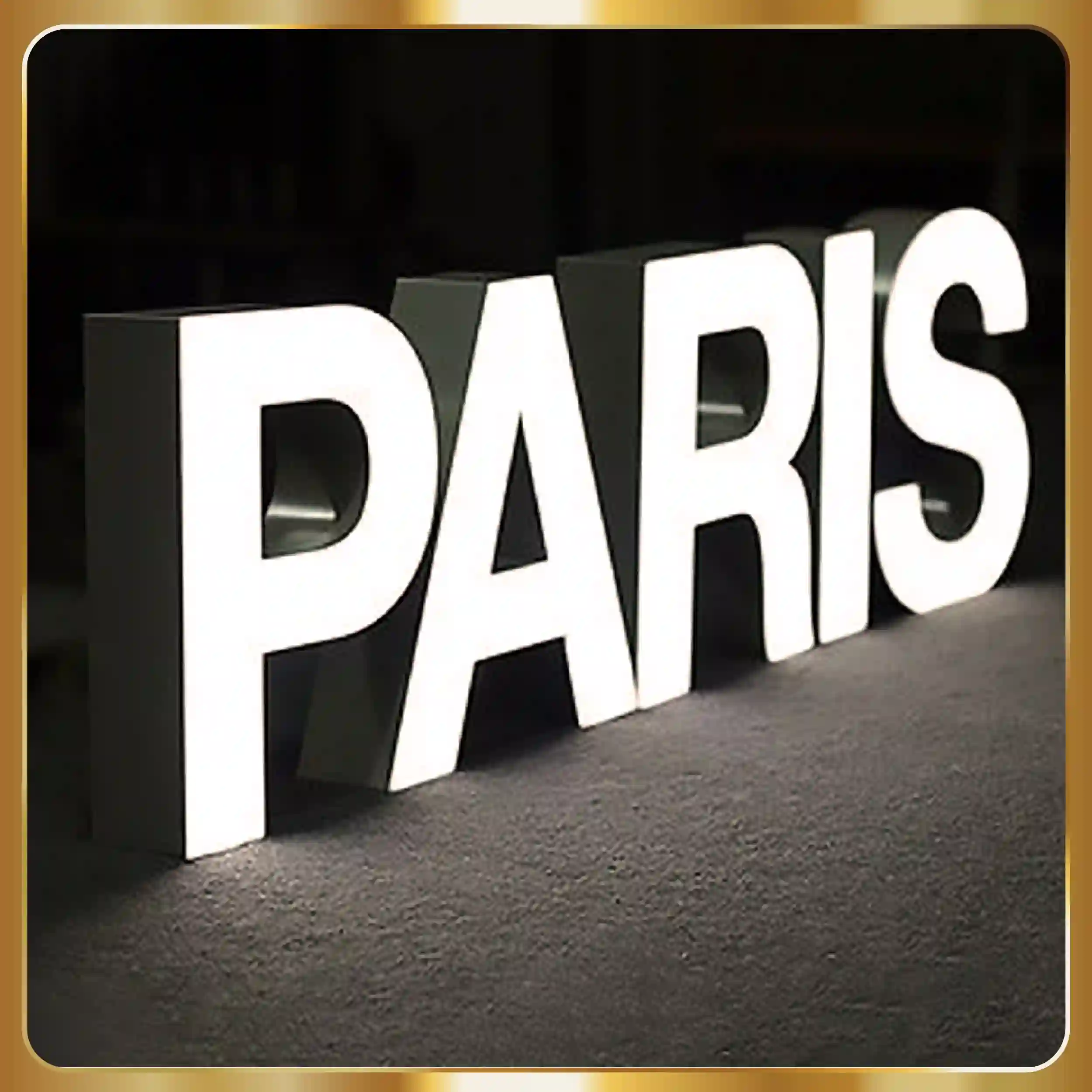 led sign with gold lettering on a black background.